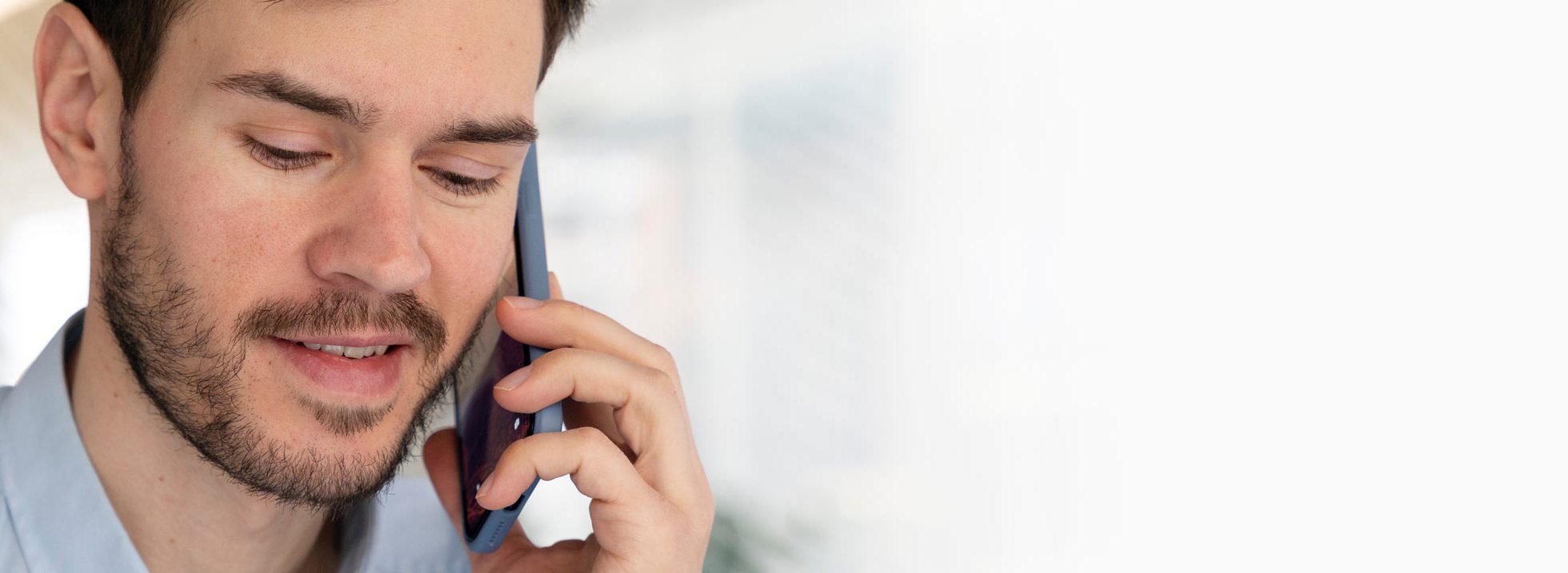 slider-young-business-man-working-her-desk-with-smartphone
